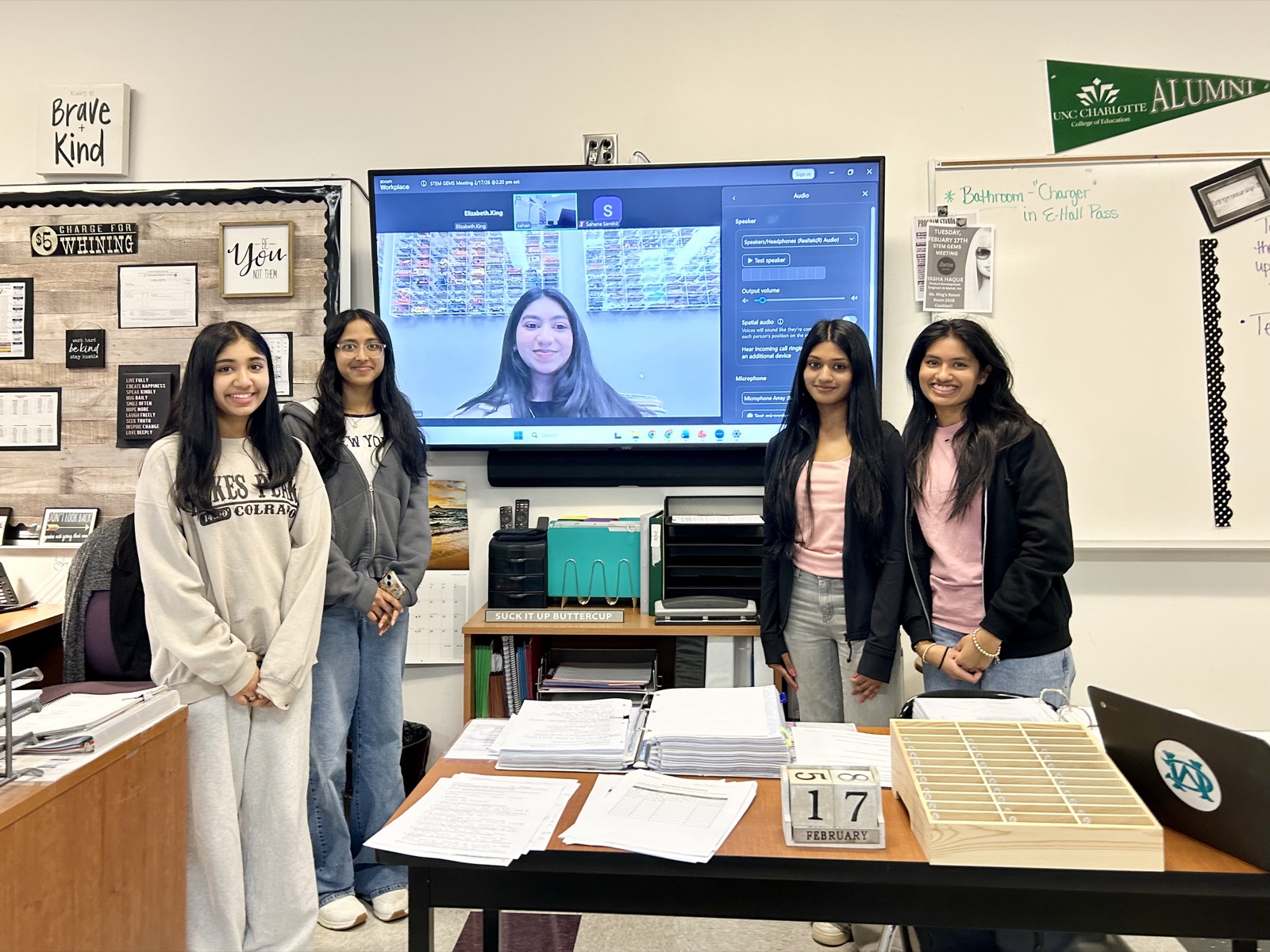 Students with a guest speaker on the classroom screen
